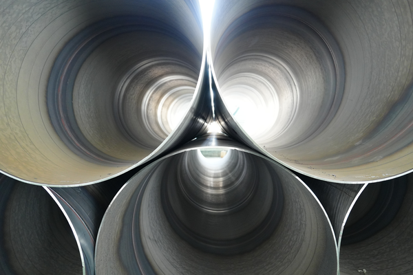 Large-diameter SSAW pipes stacked for water transmission